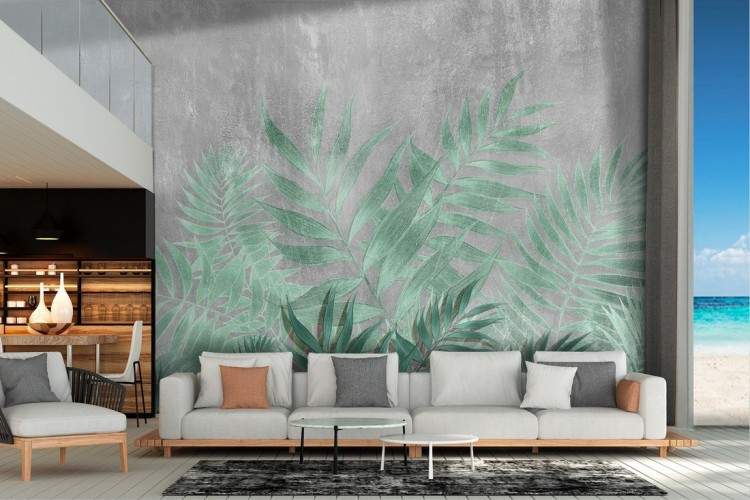 Tropical leaves wallpaper with concrete surface